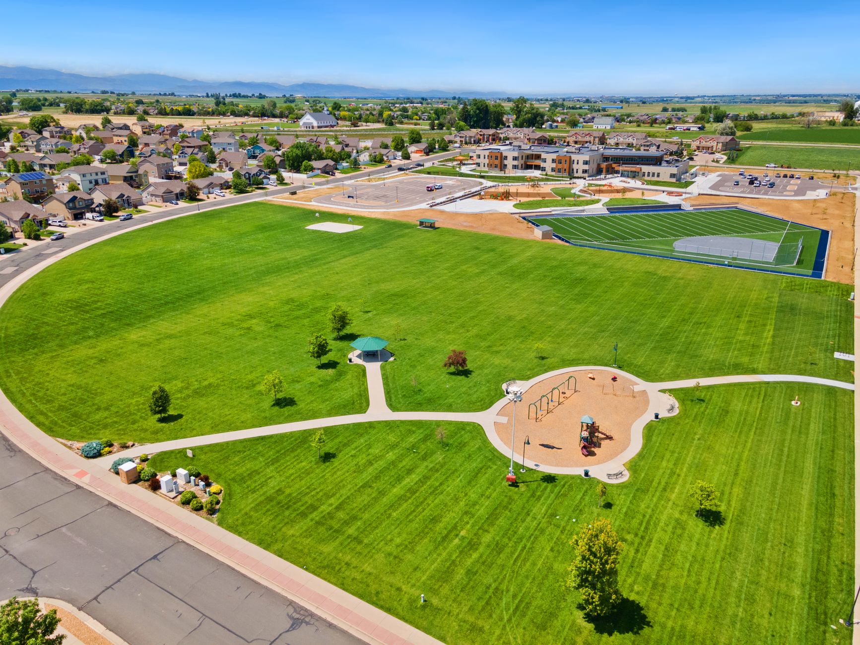 a grassy field in a town